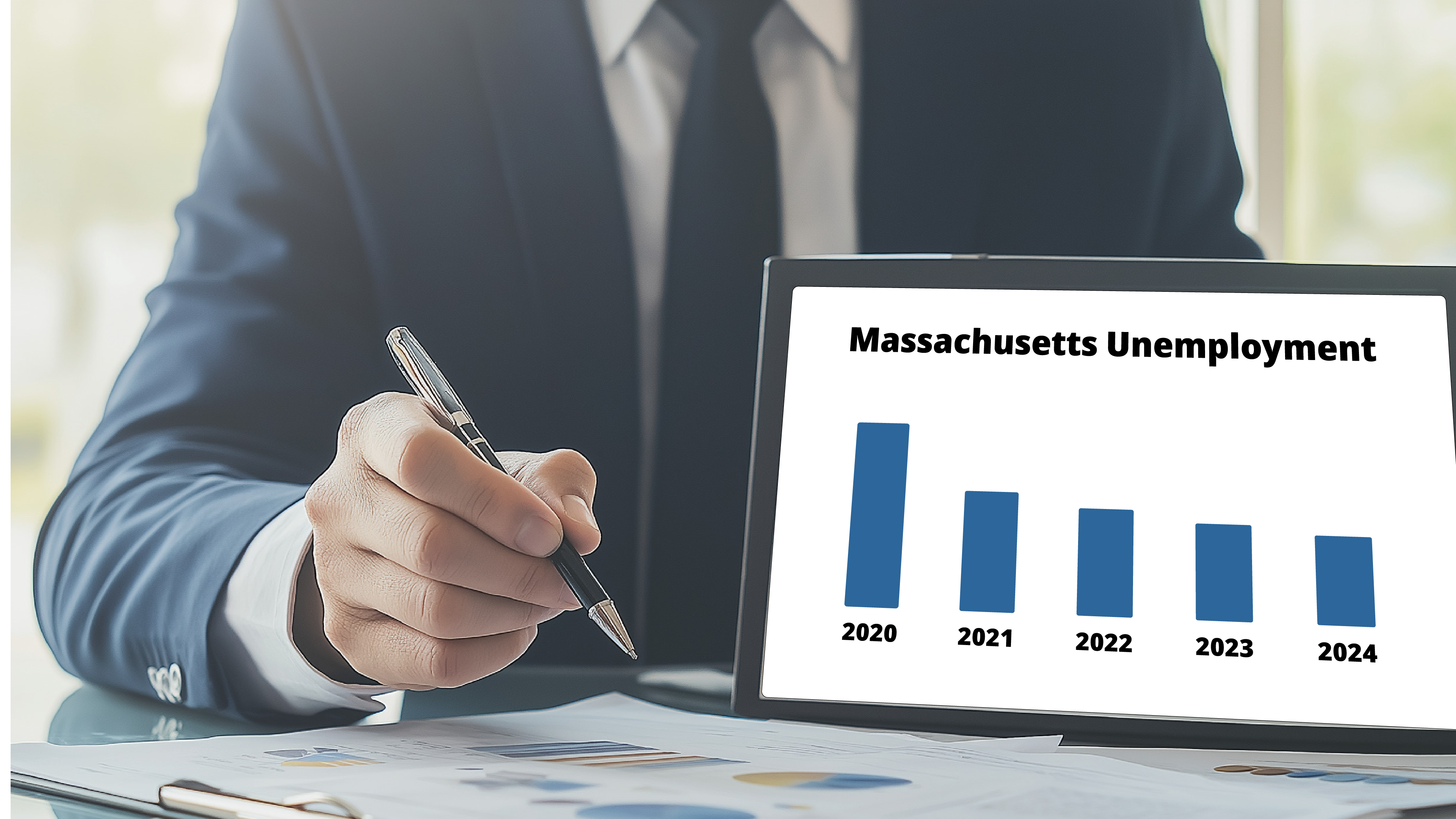 A chart showing the decline of massachusetts unemployment over 5 years displayed on a tablet.